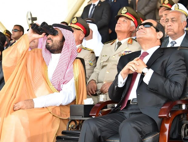 A handout picture provided by the Office of the Egyptian Presidency on July 30, 2015 shows Egyptian President Abdel Fattah al-Sisi (R) sitting next to Saudi deputy Crown Prince and Minister of Defence Mohammed bin Salman as they attend a military academy graduation ceremony in the Egyptian capital, Cairo. AFP PHOTO / AHMED FUAD / HO / EGYPTIAN PRESIDENCY == RESTRICTED TO EDITORIAL USE MANDATORY CREDIT "AFP PHOTO / AHMED FUAD / HO / EGYPTIAN PRESIDENCY" - NO MARKETING NO ADVERTISING CAMPAIGNS - DISTRIBUTED AS A SERVICE TO CLIENTS == / AFP PHOTO / EGYPTIAN PRESIDENCY / AHMED FUAD